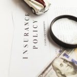 Title Insurance 101: What You Need to Know Before Closing on Your Home in Florida a magnifying glass sitting on top of a piece of paper