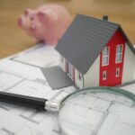 How Assignment Agreements Work for Wholesalers in Florida white and red wooden house beside grey framed magnifying glass